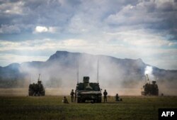 Artillery being fired during joint military drills at a firing range in northern Australia as part of Exercise Talisman Sabre, in Shoalwater Bay on July 22, 2023.