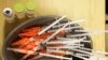 FILE - Pre-loaded syringes with COVID-19 vaccine are ready for use in New Orleans, Jan. 25, 2022. Food and Drug Administration advisers on June 15, 2023, discussed whether the next round of shots should protect only against the newest omicron strains.