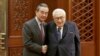 FILE - Chinese Foreign Minister Wang Yi meets former U.S. Secretary of State Henry Kissinger at the Great Hall of the People in Beijing, Nov. 22, 2019.