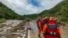 In this photo released by Xinhua News Agency, rescue workers gather aftermath of a mudslide in Weiziping village of Luanzhen township on the outskirts of Chang'an district, Xi'an of northwestern China's Shaanxi Province, Aug. 12, 2023. 
