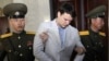 FILE - American student Otto Warmbier is escorted at the Supreme Court in Pyongyang, North Korea, March 16, 2016.