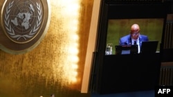 UN General Assembly President Dennis Francis reads the election results of new members to the Human Rights Council, at UN headquarters in New York City, Oct. 10, 2023. 