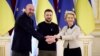 Ukrainian President Volodymyr Zelenskyy, center, European Commission President Ursula von der Leyen, right, 