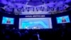 First Lady of Ukraine Olena Zelenska is seen on video screens as she delivers a speech at the World Economic Forum in Davos, Switzerland, Jan. 17, 2023. 