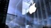 FILE PHOTO: The Apple Inc. logo is seen hanging at the entrance to the Apple store on 5th Avenue in New York