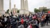 Pro-democracy activists set off on motorbikes from the Democracy Monument during a car mob protest in Bangkok on July 16, 2023 as they call on Thailand's senators to vote for Move Forward Party leader Pita Limjaroenrat in the upcoming vote for prime minis