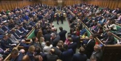 Lawmakers await the result of the vote on The European Union (Withdrawal Agreement) Bill in the House of Commons in London, Dec. 20, 2019.