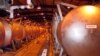 In this file photo, giant containment cylinders used to move deadly chemical weapons from storage igloos to an incinerator inside the Umatilla Chemical Weapons Disposal Facility outside Hermiston, Ore., June 8, 2004