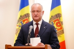 Incumbent Moldovan President Igor Dodon speaks to media in Chisinau, Moldova, Nov. 16, 2020.