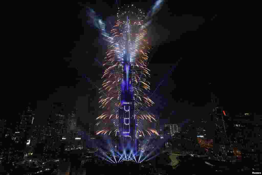 Fireworks explode over the Burj Khalifa, the tallest building in the world, during the New Year's celebration in Dubai, United Arab Emirates, Jan. 1, 2025. 