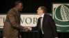 Microsoft founder Bill Gates greets Dr. Gebisa Ejeta, 2009 World Food Prize Laureate, left, before speaking at the World Food Prize symposium, Oct. 15, 2009, in Des Moines, Iowa.