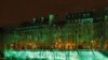 FILE - The Ile Saint-Louis is illuminated with the lettering reading 'The Paris accord is done' in Paris, Nov. 4, 2016, to mark the first day of the enforcement of the Paris COP21 climate accord. 
