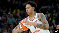 FILE - Phoenix Mercury center Brittney Griner grabs a rebound against the Seattle Storm during a WNBA game on Aug. 5, 2023, in Phoenix. Griner has re-signed with the Mercury, the only WNBA team she has played for. The deal was announced by the league on March 29, 2024.