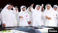 FILE - Qatar Secretary-General Hassan Al-Thawadi (3rd L), of the nation's 2022 World Cup organizing committee, speaks during a news conference in June 2014.