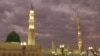 FILE -- In this July 5, 2013 file photo, worshipers visit the Prophet's Mosque in Medina, Saudi Arabia.