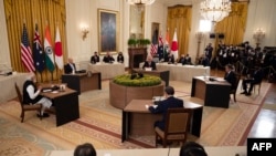  2021 年 9 月 24 日，四國集團領導人在華盛頓特區的白宮參加有史以來第一次面對面的四國領導人峰會。