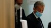 Former French President Nicolas Sarkozy leaves the courtroom in Paris, March 1, 2021. A Paris court found him guilty of corruption and influence peddling and sentenced him to one year in prison, Sep 30, 2021. 