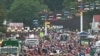 A crowd walks along part of the fair grounds at the Iowa State Fair, in the state capital Des Moines, August 12, 2011