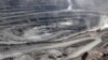FILE - Miners are seen at the Bayan Obo mine containing rare earth minerals, in Inner Mongolia, China, July 16, 2011. China dominates the critical minerals sector, but Australia has announced a plan to mine and process the minerals.