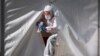 A medical staffer leaves the tent of a testing point for COVID-19 in central Moscow on May 2, 2020. 