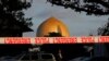 A police officer stands guard in front of the Al Noor Mosque in Christchurch, New Zealand, March 17, 2019, where one of the two mass shootings occurred.