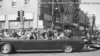 The vehicle carrying President John Kennedy, with a Secret Service agent, riding on the rear bumper, in Dallas, Texas, Nov 22, 1963 (Dallas Times Herald/ The Sixth Floor Museum).