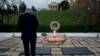 Attorney General Eric Holder pays his respects at the grave of John F. Kennedy at Arlington National Cemetery, Nov. 22, 2013, on the 50th anniversary of Kennedy's death. 