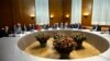 European Union foreign policy chief Catherine Ashton (2nd R) speaks with Iranian Foreign Minister Mohammad Javad Zarif (R) before the start of two days of closed-door nuclear talks at the United Nations European headquarters in Geneva, Switzerland, Nov. 20., 2013. 