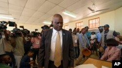 Botswana's President Mokgweetsi Masisi arrives to vote in general elections in Moshupa, west of Gaborone, Botswana, Oct. 23, 2019. 