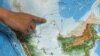 FILE PHOTO: Indonesia's Deputy Minister for Maritime Affairs Arif Havas Oegroseno points at the location of North Natuna Sea on a new map of Indonesia during talks with reporters in Jakarta, Indonesia, July 14, 2017. REUTERS/Beawiharta/File Photo